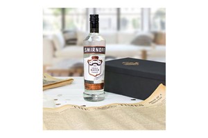 Black Smirnoff Vodka and Original Newspaper