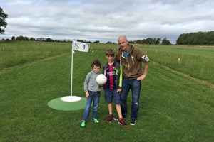 Family Round of Kick Golf for Two Adults and Two Children