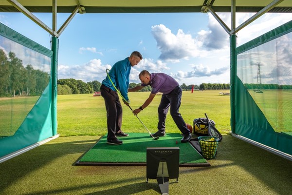 Golf pro teaching a golf lesson in York