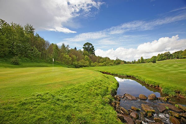 A scenic golf course in the Scottish countryside