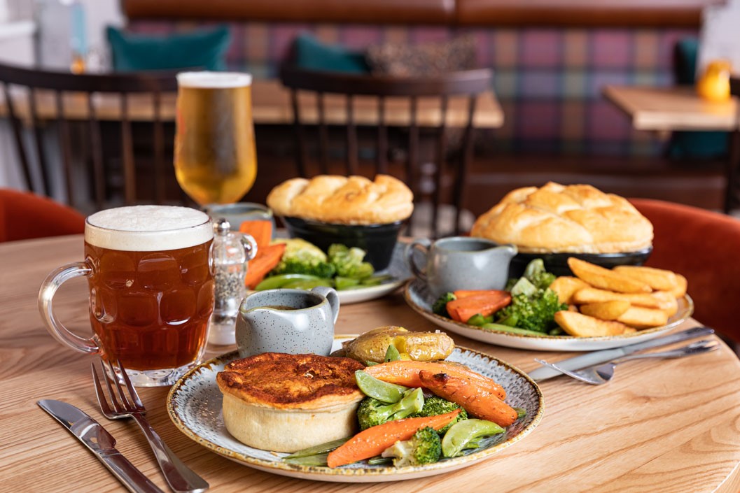 Two Course Meal with a Drink for Two at a British Pub or Bar