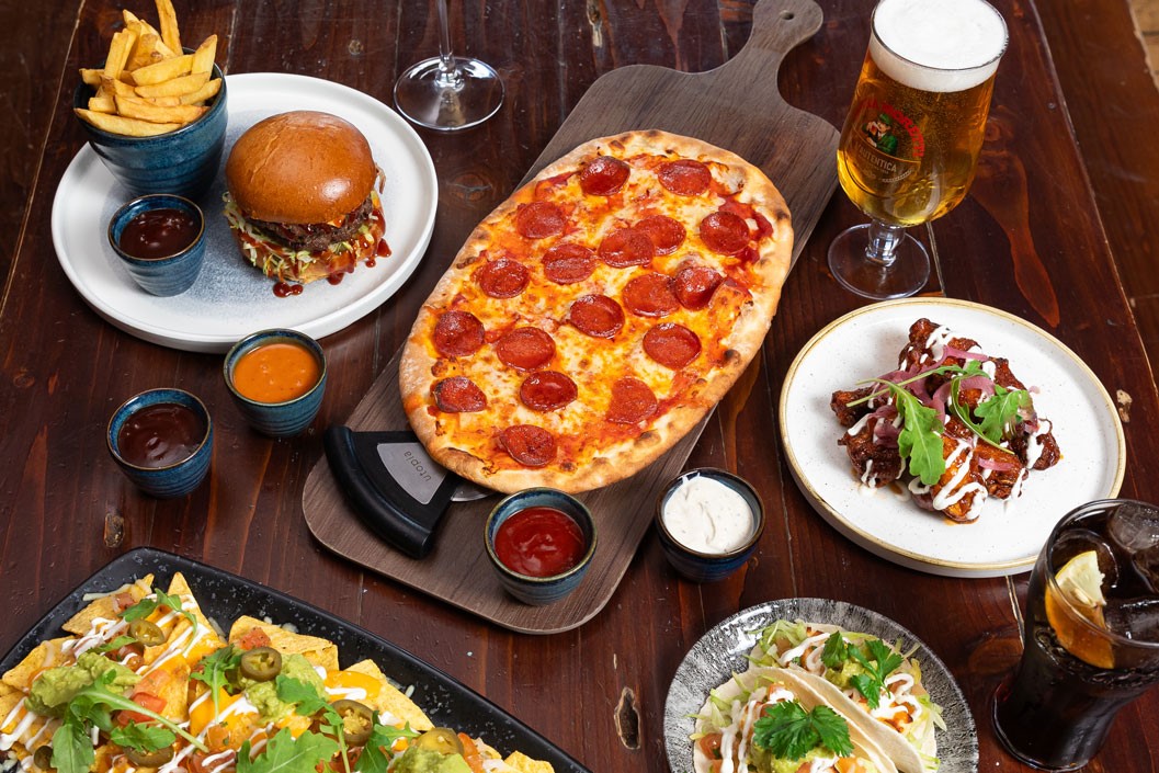 Two Course Meal with a free Beer for Two at a British Pub or Bar