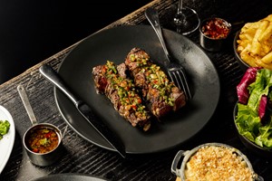 Sharing Steak, Sides and Bottle of Wine for Two at Gaucho Image 2