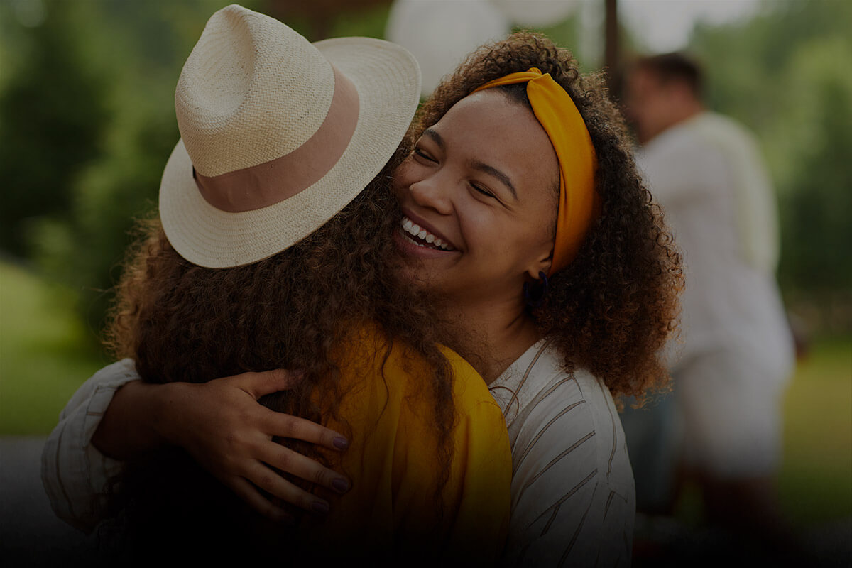 Two female friends hugging