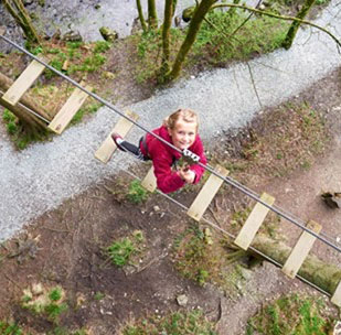 Child playing at Go Ape