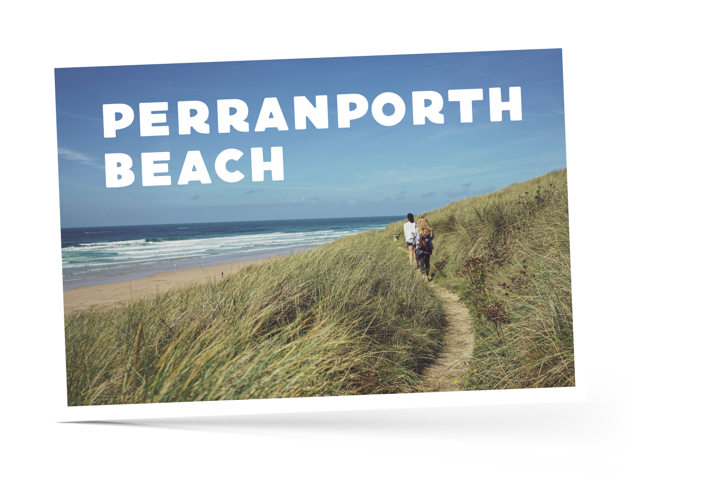 Two people walking along a footpath at Perranporth Beach in Cornwall